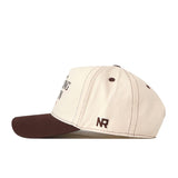 Introducing the Bowling Green State Falcons Vintage Hat by No Rivals—a beige cotton cap featuring a classic brown brim and matching brown stitching. The side of the hat is embroidered with the initials NR in brown thread, while a snap back closure ensures an adjustable, comfortable fit.
