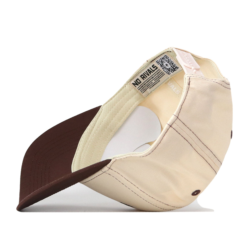 The No Rivals Bowling Green State Falcons Vintage Hat, crafted from high-quality cotton in beige and brown, is shown positioned on its side to reveal the inside labels, stitching details, and a QR code on the inner tag. This snapback cap features an embroidered logo for a premium touch.