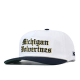 Michigan Old English Rope Hat, a white baseball cap with a dark blue brim, adjustable snap back, and Michigan Wolverines embroidered in Old English font on the front.
