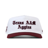 Texas A&M Old English Rope Hat, a white 5-panel cap with a maroon brim, maroon Old English text, a maroon rope at the base of the crown, and a snapback adjustment.