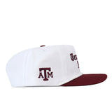 Texas A&M Old English Rope Hat, a white 5-panel baseball cap with a maroon brim, rope detail, maroon A&M lettering on the side, front text, and a snap back adjustment.