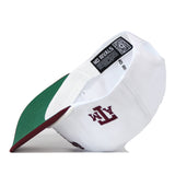Texas A&M Old English Rope Hat, featuring a white 5-panel crown with a maroon logo on the side, green underbrim, snapback adjustment, and interior branded tag.