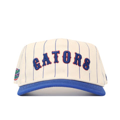 The No Rivals Florida Walk Off Hat features blue pinstripes on white, “GATORS” in blue and orange, a blue brim, a side Florida Gators logo patch, and a snapback closure for an adjustable fit.
