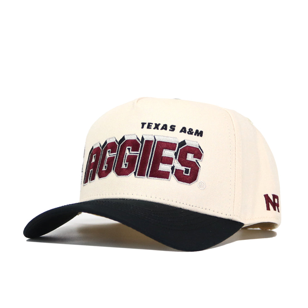 The Texas A&M Alma Mater Hat by No Rivals is a cream-colored, officially licensed cap with a black curved brim. "TEXAS A&M AGGIES" stands out in maroon and black on the front, and an embroidered maroon NF is on the right side. High quality cotton.