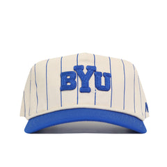 The No Rivals BYU Pinstripe Hat features a cream color with blue pinstripes, bold BYU embroidery, a blue brim, and an unstructured fit. Snapback closure ensures one size fits most.