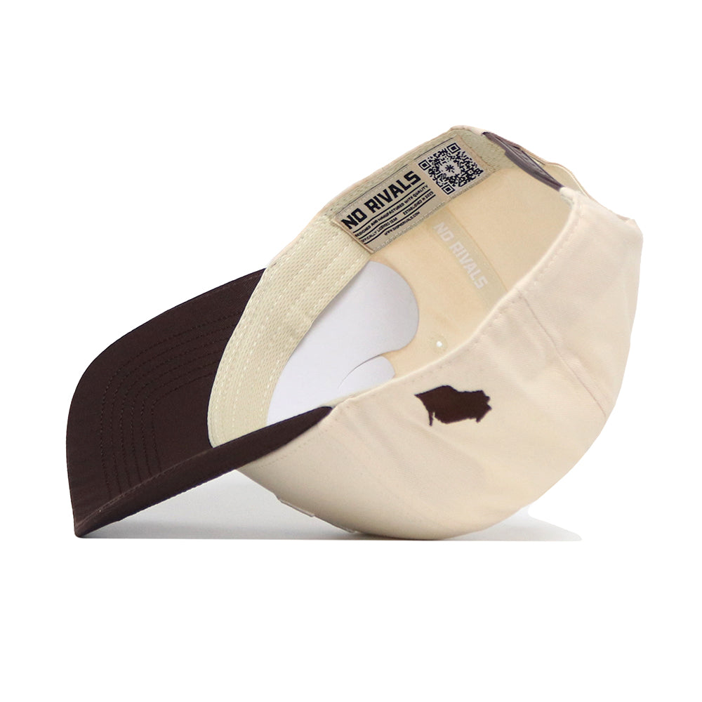The Marquette Espresso Hat by No Rivals is a beige and brown structured cotton snapback. Flipped upside down, it reveals a NO RIVALS inner band and a bison silhouette logo.