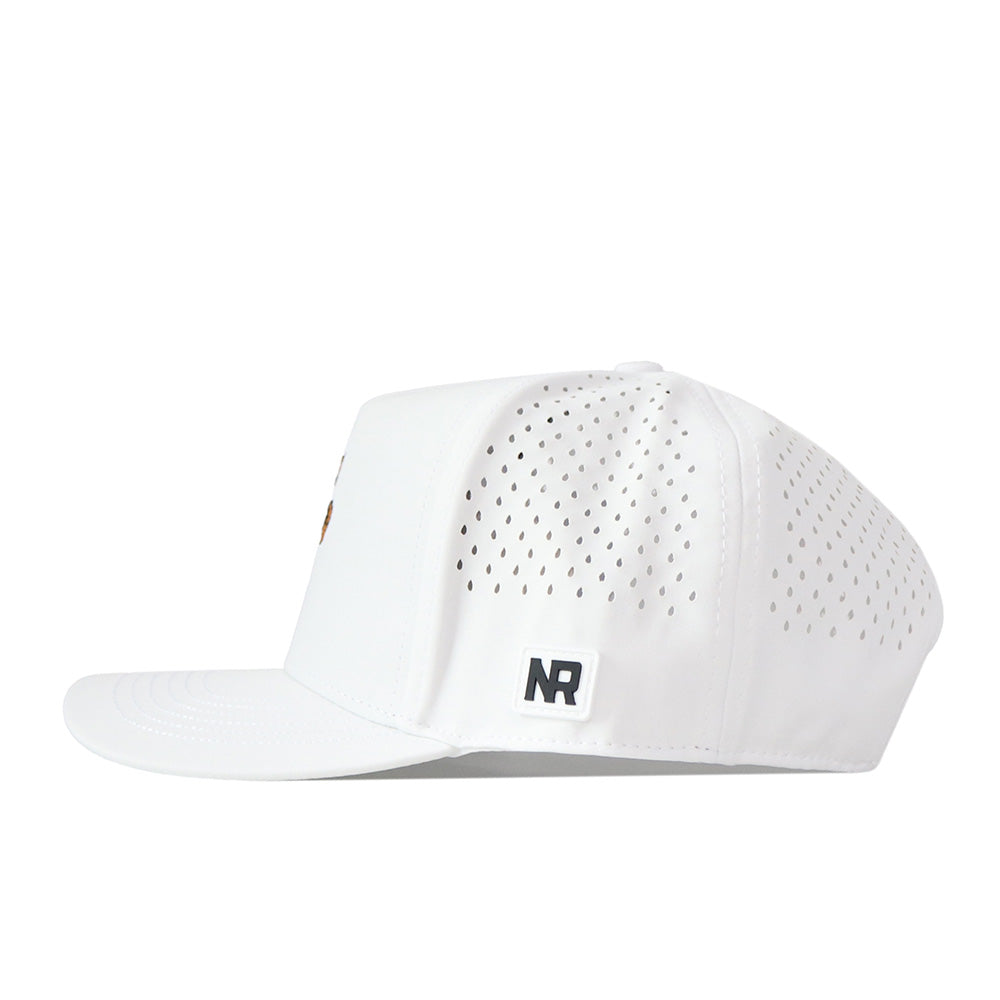 The Kentucky Wildcats Football Mascot Hat by No Rivals is a white snapback crafted from performance fabric, with perforated side panels for ventilation, a flat brim, and a small black-and-white NR logo patch on the left side above the brim. The hat is shown in a side profile view.