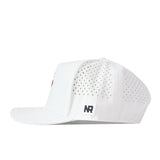 The Kentucky Wildcats Football Mascot Hat by No Rivals is a white snapback crafted from performance fabric, with perforated side panels for ventilation, a flat brim, and a small black-and-white NR logo patch on the left side above the brim. The hat is shown in a side profile view.