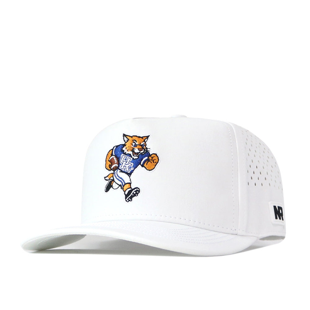 The Kentucky Wildcats Football Mascot Hat - White by No Rivals is a white baseball cap featuring a running wildcat mascot in a blue UK jersey. Crafted from performance fabric, this officially licensed hat includes small ventilation holes on the sides, a black No Rivals logo near the brim, and an adjustable snap back for a comfortable fit.