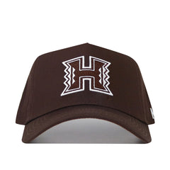 The Hawaii Americano Hat is a brown hat with a letter detail, featuring a snapback design and structured fit.