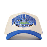 Show your team spirit with the No Rivals BYU Cougars Stadium Hat—a beige and blue snapback featuring Brigham Young Cougars text and an embroidered stadium design on the front. The perfect accessory to elevate your gameday fit!.
