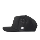 The Tarleton Athletic Legacy Hat by No Rivals is a black baseball cap with small ventilation holes on the side panels and a white NR logo embroidered above the left ear. Displayed in a side view against a white background, this premium athletic hat features a sleek snap back closure for a customized gameday fit.
