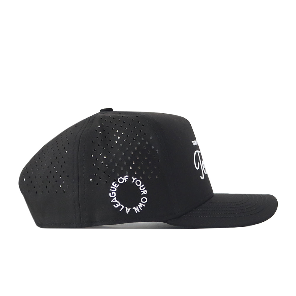 Introducing the Tarleton Athletic Legacy Hat by No Rivals—a black baseball cap featuring perforated side panels for breathability and a snap back adjustment for a customizable fit. The front is detailed with white text, while a circular “A LEAGUE OF YOUR OWN” design accents the back, making this premium athletic hat the ideal finishing touch to your gameday look.