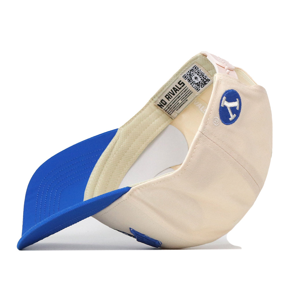 Turn heads on gameday with the BYU Cougars Stadium Hat by No Rivals—a cream and blue snapback styled inside out to highlight its embroidered H logo on the side, a crisp blue brim, and interior tags featuring both “NO RIVALS” and a QR code.