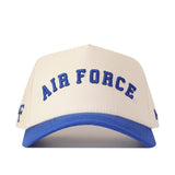 The Right Side Up Air Force Hat - Classic Colors by No Rivals is a cream and blue baseball cap featuring an embroidered AIR FORCE logo in bold blue letters on the front, complete with a Snap Back Adjustment for the perfect gameday fit.