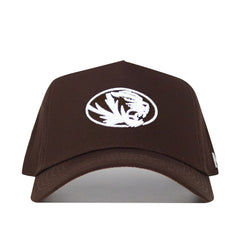 The Mizzou Americano Hat is a brown snapback featuring a white embroidered stylized tiger head in an oval on the front, made from high-quality cotton for a comfortable, structured fit.