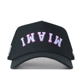 Introducing the FIU Panthers | Upside Down Miami Hat - Blackout by No Rivals: a black snapback cap showcasing “MIAMI” embroidered upside down in bold white and pink on the front—perfect for anyone seeking a unique, standout Miami hat style.
