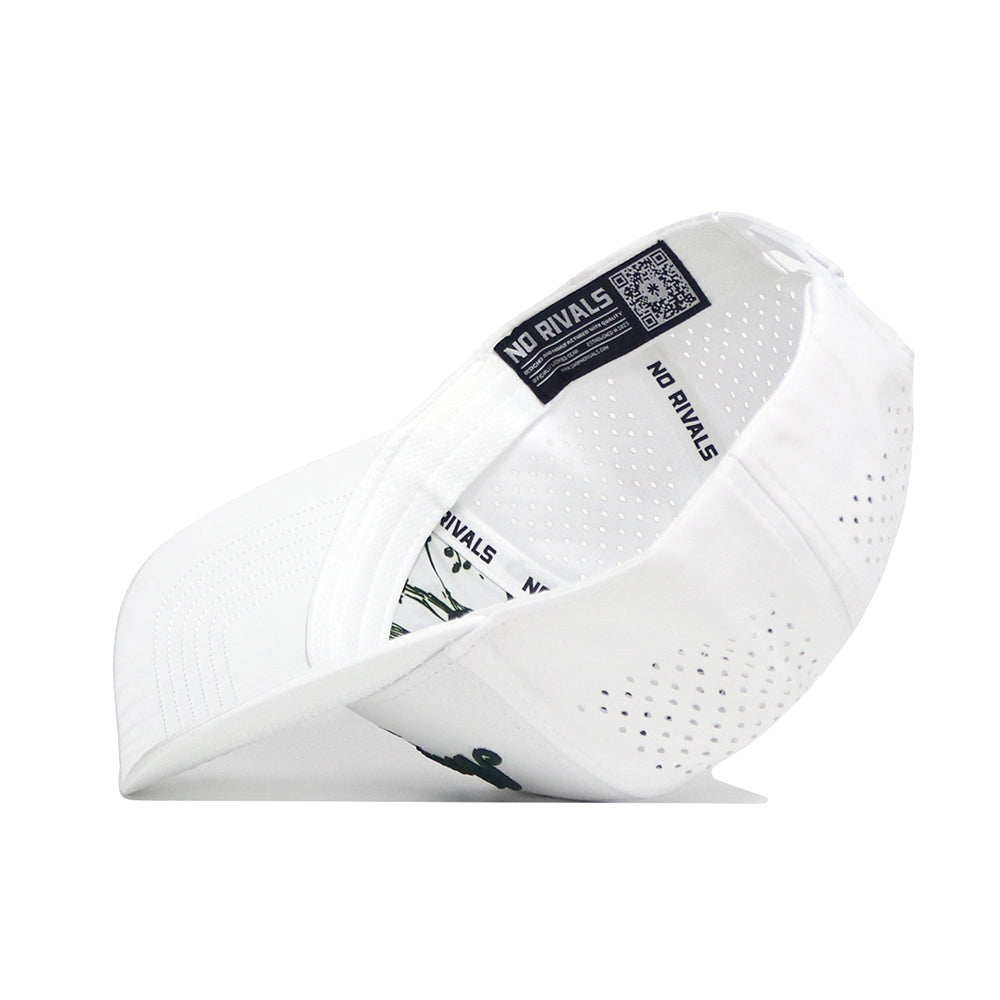 A North Carolina Clubhouse Hat by No Rivals is shown on its side, revealing an inside label with the brand name and a QR code. Made from a polyester-cotton blend, it features ventilation holes and a curved brim for a comfortable fit.