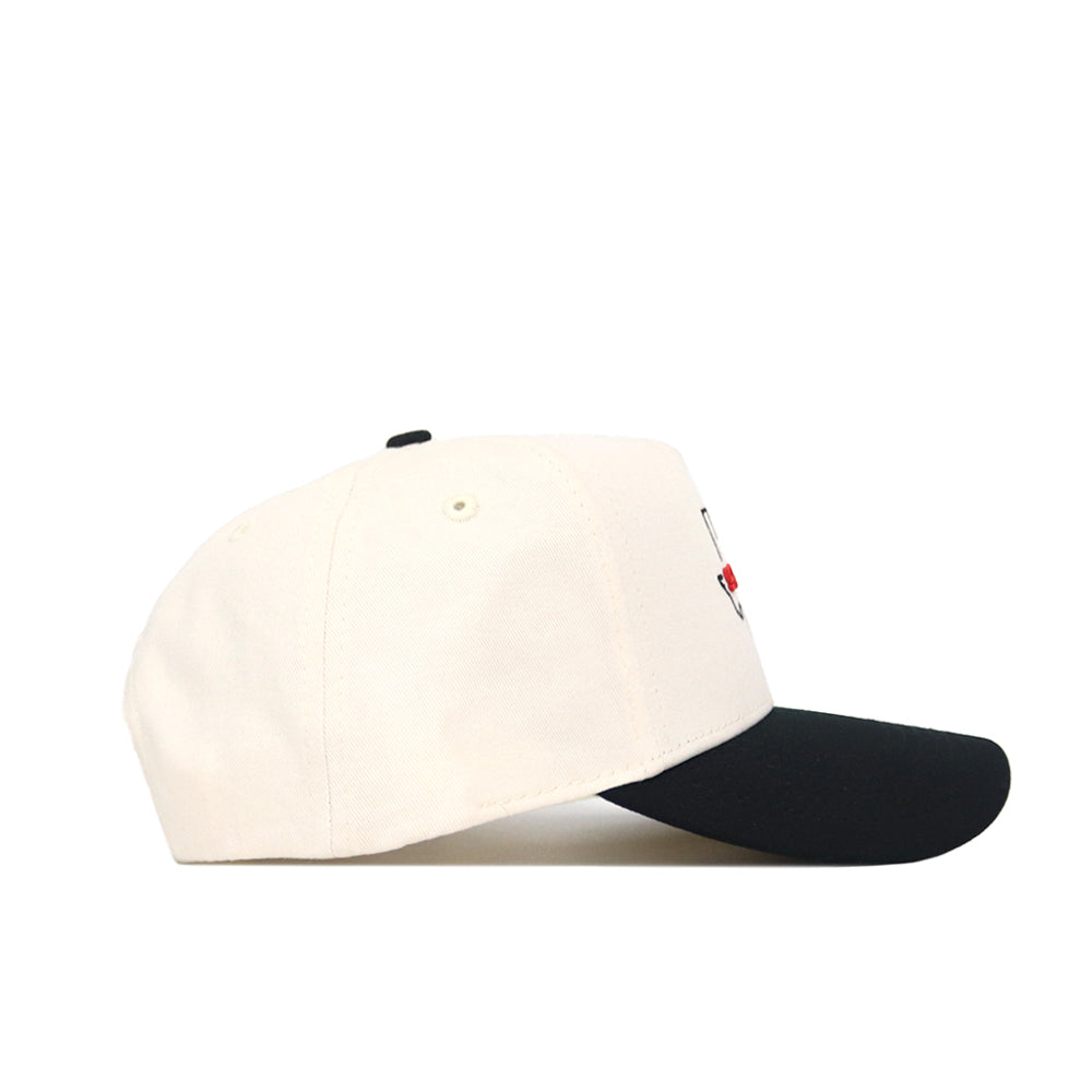The Scheels Texas Hat - Black is a structured fit cap with a black curved brim, crafted from high-quality cotton and shown from the side against a white background.