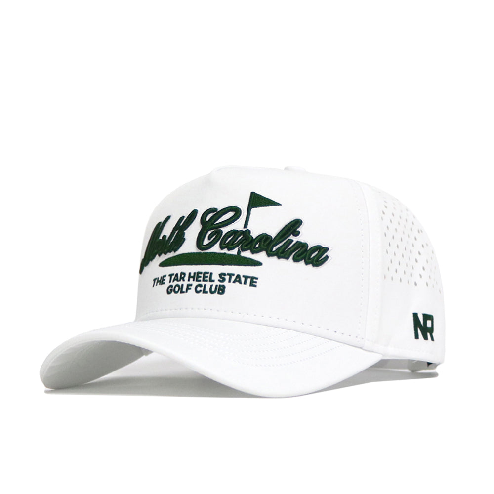 The No Rivals North Carolina Clubhouse Hat is a white snapback with a structured fit, featuring "North Carolina" and "The Tar Heel State Golf Club" embroidered in dark green, perforated sides for ventilation, and "NR" on the side.