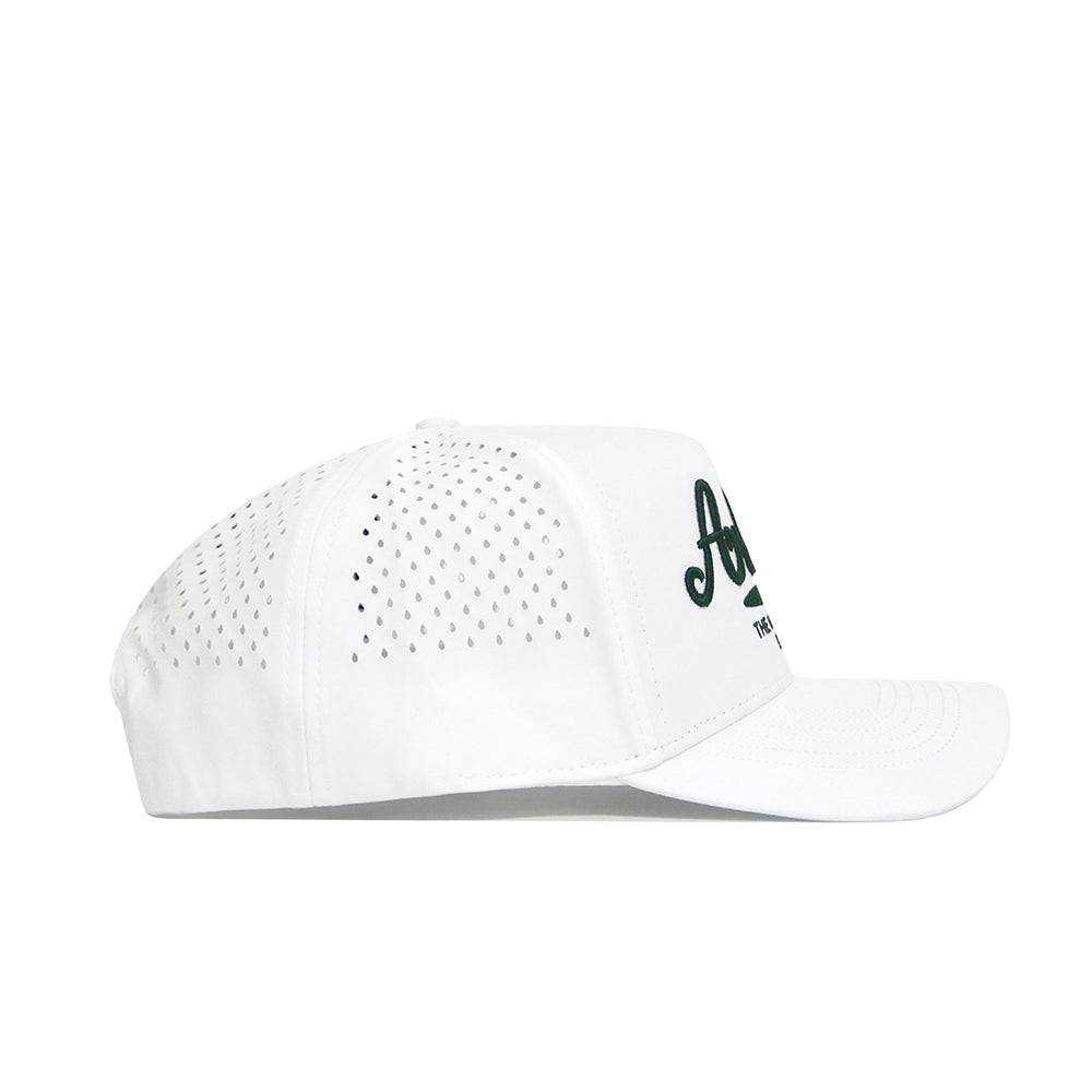 The No Rivals Arkansas Clubhouse Hat is a white snapback with side ventilation holes, a curved brim, and partially visible dark green front text. Seen from the side, this hat has a structured fit.