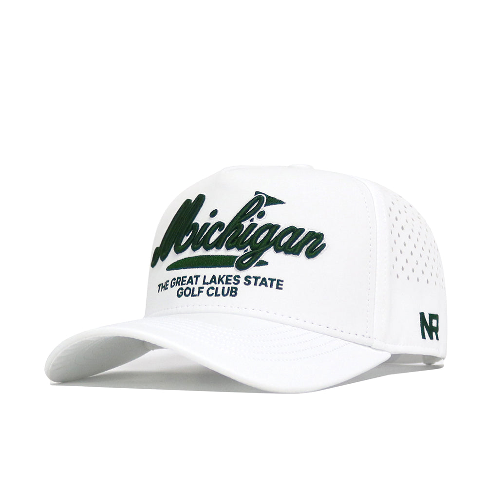 The Michigan Clubhouse Hat by No Rivals is a white, structured-fit baseball cap with “Michigan” in bold green script and “The Great Lakes State Golf Club” beneath. Made from a poly-cotton blend, it has ventilation holes, snapback closure, and a green NR logo on the side.