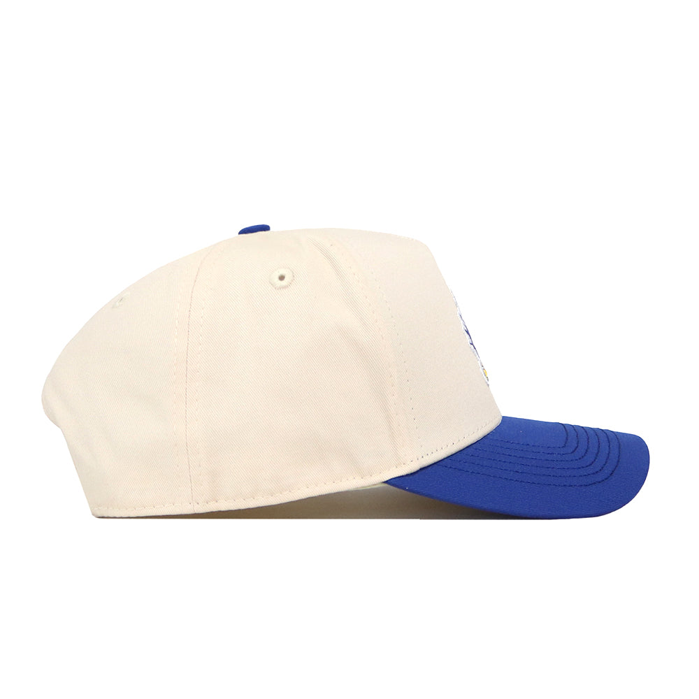 The No Rivals Kansas Jayhawks Halftime Hat, shown in a side view against a white background, features a cream-colored crown with a blue brim, embroidered logos, and an adjustable snap back closure.