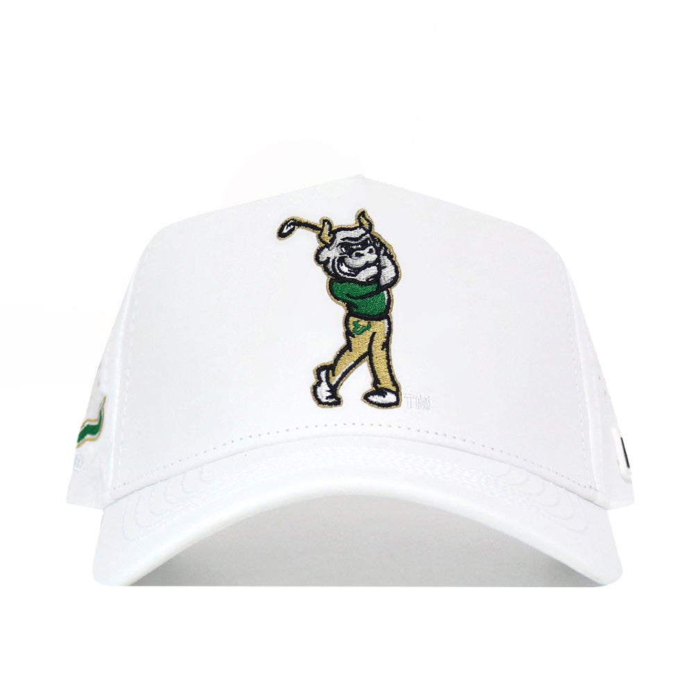 The USF Golf Hat - White by No Rivals is a classic white baseball cap adorned with an embroidered cartoon dog on the front, swinging a golf club while dressed in a green shirt and tan pants. An additional embroidered logo detail adds playful charm to the design. Featuring a snap back closure, this hat ensures the perfect fit for gameday.