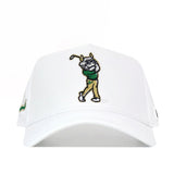 The USF Golf Hat - White by No Rivals is a classic white baseball cap adorned with an embroidered cartoon dog on the front, swinging a golf club while dressed in a green shirt and tan pants. An additional embroidered logo detail adds playful charm to the design. Featuring a snap back closure, this hat ensures the perfect fit for gameday.