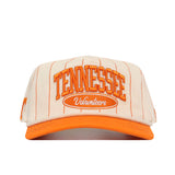 Showcasing a front view, the Tennessee Pinstripe Traditions Hat by No Rivals features cream and orange pinstripes with an embroidered TENNESSEE logo in large letters and “Volunteers” below on the front. Made from a comfortable cotton blend, this cap combines style and durability.