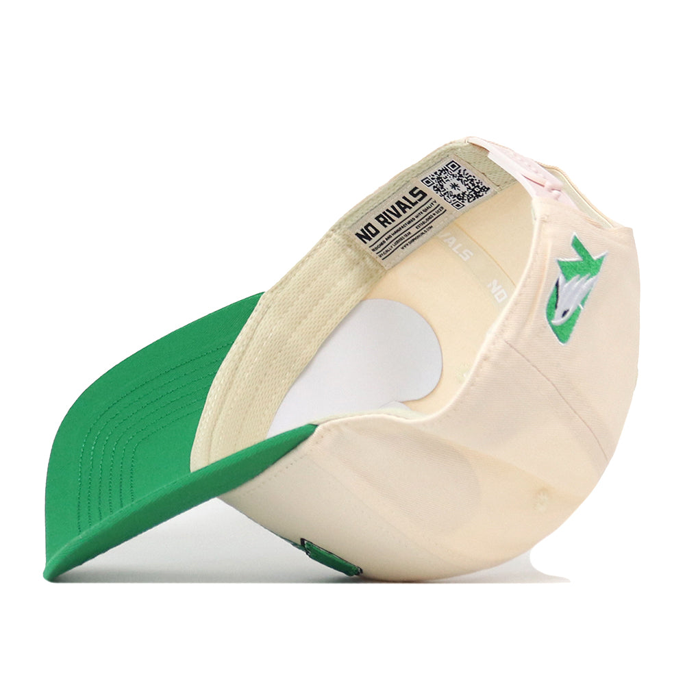 The North Dakota Fighting Hawks Stadium Hat by No Rivals is displayed upside down, showcasing its cream and green snapback design, an embroidered shark logo on the side, and a subtle NO RIVALS label under the brim—perfect for topping off your gameday outfit.
