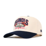 Show your team pride with the Illinois Fighting Illini Stadium Hat by No Rivals. This cream and navy snapback features the Illinois Fighting Illini and an embroidered stadium design on the front, a navy bill, and detailed logos—including the New Era logo stitched on the side. This officially licensed cap is perfect for any fan.
