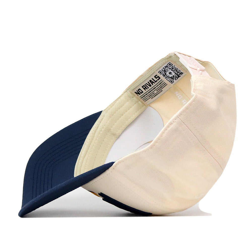 The No Rivals WVU Mountaineers Stride Hat is shown turned inside out, revealing the interior label, stitching details, and a QR code. Crafted from high quality cotton, this structured fit cap features a beige crown contrasted by a navy blue brim.