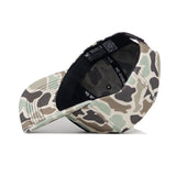 The North Dakota Huntsman Hat by No Rivals is shown on its side, displaying its interior, underside of the brim, 5-panel design, inner band with “NO RIVALS,” and an inside QR code.