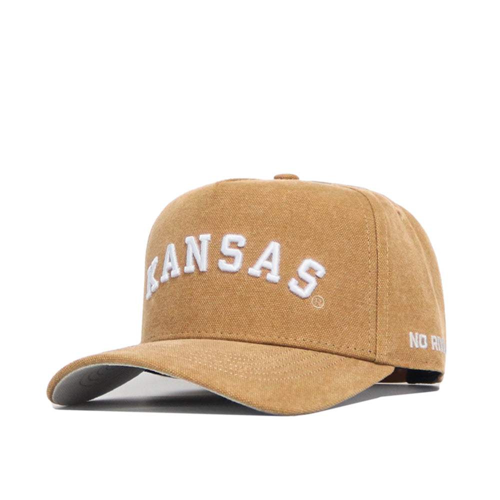 The No Rivals Kansas Rustic Hat is a brown cotton canvas snapback with "KANSAS" embroidered in white on the front and "NO RULES" on the brim, combining structured style and comfort.