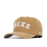 This tan cotton canvas South Dakota State Rustic Hat by No Rivals features a structured fit, white embroidered “JACKS” on the front, and “NO RIV…” partially visible on the brim’s side.