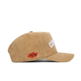 The No Rivals Oklahoma State Rustic Hat is a tan cotton canvas snapback with "COWBOYS" in white on the front and an orange OSU logo on the side. This structured cap is shown from a side angle against a white background.