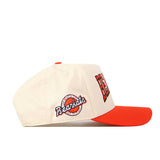The No Rivals SHSU Bearkats Retro Block Hat is a cream and orange licensed snapback baseball cap featuring the Bearkats logo and lettering on the side, complete with an orange bill and cream crown—shown in a side profile view, it’s the perfect finishing touch for your gameday fit.