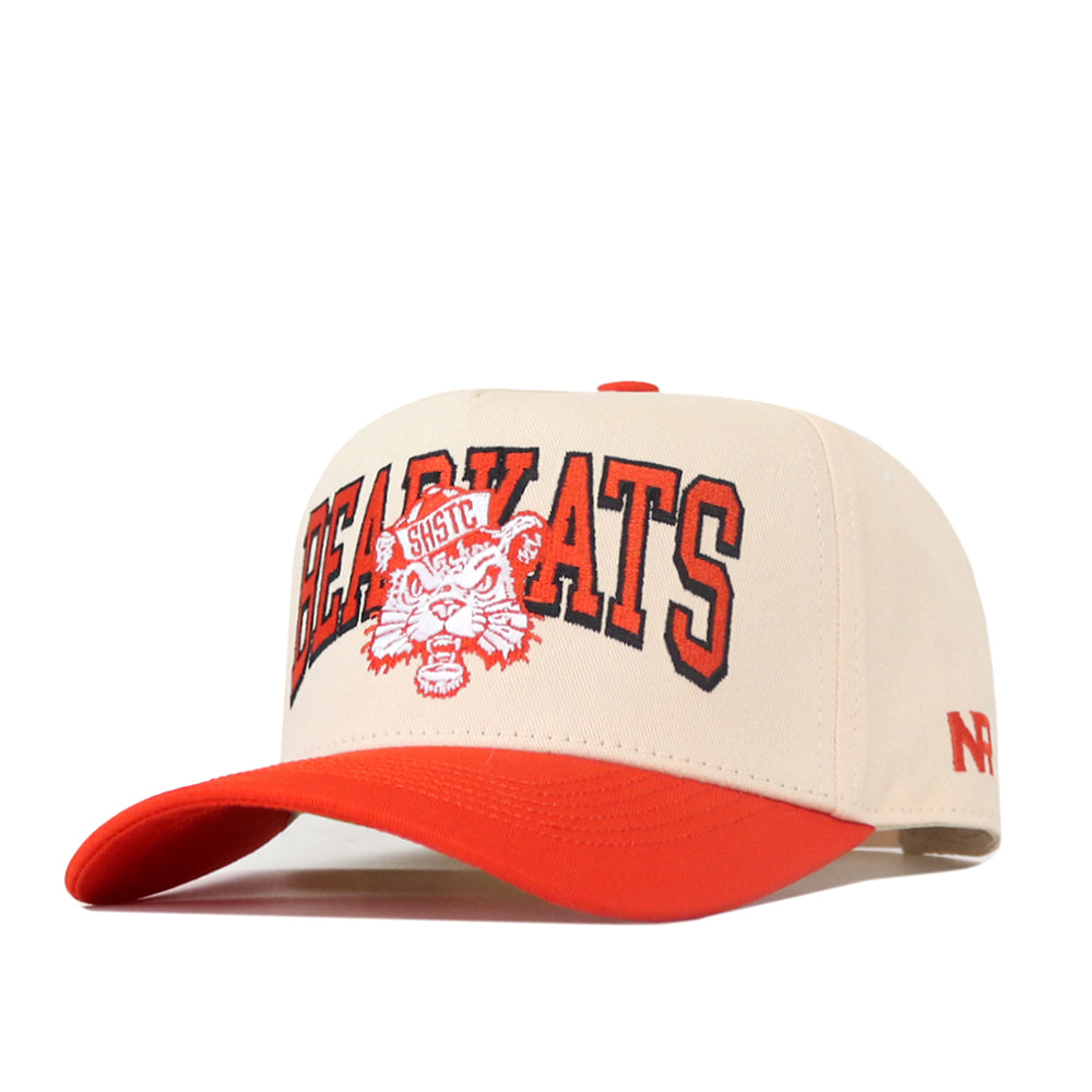 Introducing the SHSU Bearkats Retro Block Hat by No Rivals—a beige and red licensed snapback baseball cap featuring “BEARKATS” and a wildcat logo embroidered on the front, with “SHSU” in bold red letters above the wildcat’s head. Complete with a red brim, a striking red “N” on the side, and classic style perfect for your ultimate gameday fit.