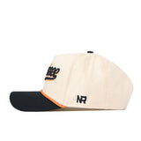 The Tennessee Old Script Neyland Hat by No Rivals features a beige crown with a black brim, orange accents, and embroidered script text on the front. The side displays the initials “NR” in black stitching, while a classic snapback closure ensures an adjustable fit.