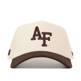 Introducing the Air Force Espresso Hat by No Rivals—a beige baseball cap with a brown brim and “AF” intricately embroidered on the front. Designed with a structured fit, this hat ensures lasting comfort and timeless style.