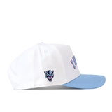 Check out the FIU Panthers | Upside Down Miami Hat - Whiteout by No Rivals—a white snapback with a light blue brim, featuring an embroidered panther head on the side and bold pink and blue “Miami” text on the front. The perfect statement piece for any fan!.