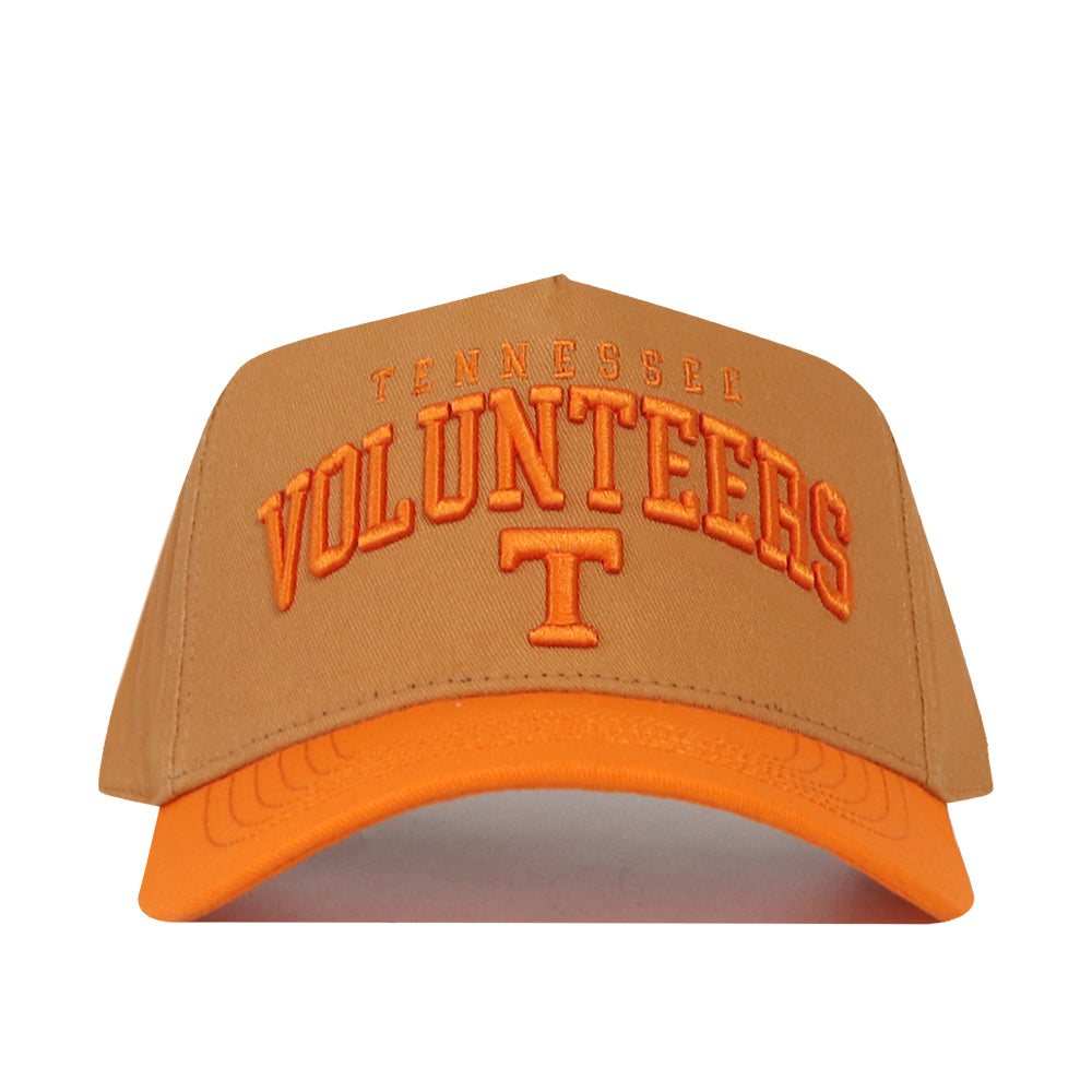 Introducing the Tennessee Rivalry Hat by No Rivals—a snapback cap in brown and orange, featuring a large orange “T” and “Tennessee Volunteers” embroidered on the front. Crafted from high-quality cotton for exceptional comfort and style.