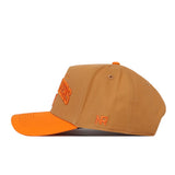 Introducing the Tennessee Rivalry Hat by No Rivals: A tan baseball cap accented with an orange brim and bold orange embroidery, showcased in a side view. The initials “NR” are stitched near the back, while the high-quality cotton construction and snapback closure ensure comfort and style. An eye-catching embroidered logo provides a distinctive finishing touch.
