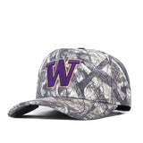 The No Rivals Washington Huskies Outland Hat is a camouflage baseball cap featuring a large, officially licensed purple and gold “W” embroidered on the front, shown angled against a white background.