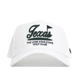 The No Rivals Texas Clubhouse Hat is a white, structured hat with "Texas" and a black golf flag embroidered, plus "THE LONE STAR STATE GOLF CLUB" on the front. Made from a comfy poly-cotton blend with an adjustable snapback closure.