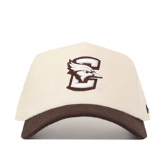The No Rivals Creighton Espresso Hat is a cream snapback with a dark brown brim, crafted from premium cotton and features an embroidered stylized C and bird logo on the front.