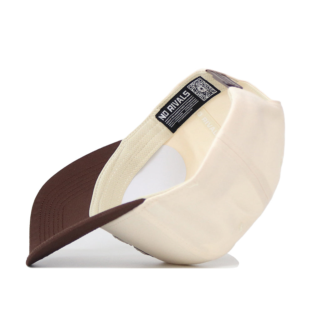 The Creighton Espresso Hat by No Rivals is shown upside down, highlighting its high-quality cotton interior band, a QR code label, and the NO RIVALS brand name on the inner lining.