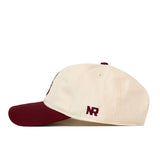 Off-white unstructured Texas A&M Bear Hat - 6 Panel Unstructured with a maroon brim, a maroon top button, and officially licensed No Rivals embroidery on the side.