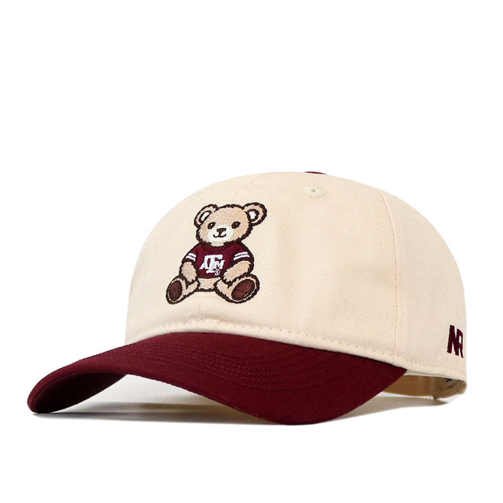 No Rivals Texas A&M Bear Hat - 6 Panel Unstructured, a cream-colored unstructured cap with a maroon brim and an embroidered bear wearing a maroon sweater with the letters A&M on the front.